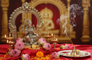 Maa Lakshmi brass idol with ornate arch on sacred altar with lotus flowers and diyas – My Guru Ji