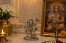 Panchmukhi Hanuman brass idol with silver finish on sacred altar with diyas and marigold – My Guru Ji