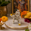 Laddu Gopal Crawling Baby Krishna Idol in Silver Finish with Peacock Crown and Gemstone Jewellery on Marble Base