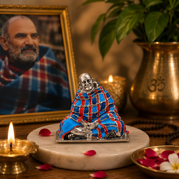 Neem Karoli Baba Murti with Blue and Red Shawl in Devotional Setting