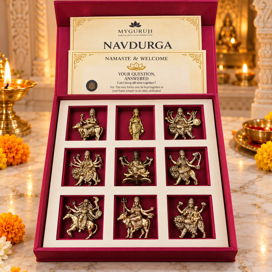 Nine Navdurga figures arranged in a red keepsake presentation box with marigold flowers