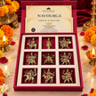 Front view of nine Navdurga figures in individual compartments of a red presentation box