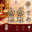 Ganesh and Laxmi brass diyas with silver finish, decorative arches and product specifications