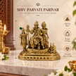 Gold-toned brass Shiv Parvati Parivar statue displayed on a marble surface with decorative props and overlaid product info text including height, weight, and material details.