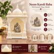 Neem Karoli Baba idol with mandir displayed with flowers in a devotional setting