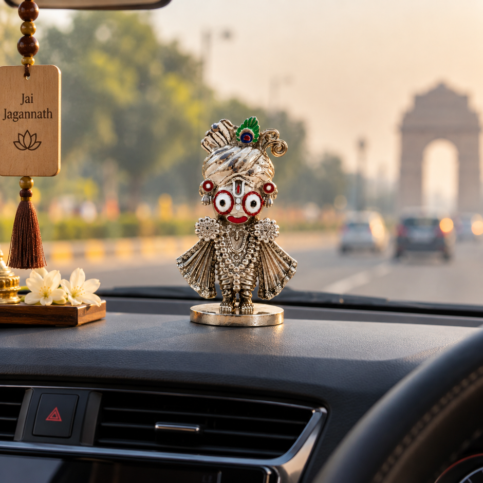 Jagannath Ji silver-finish idol displayed with devotional decor and temple artwork