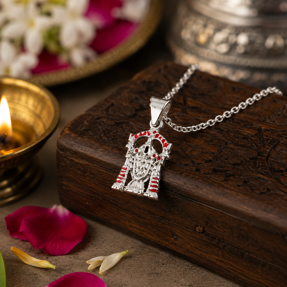 Tirupati Balaji pendant in brass silver finish with red enamel on wooden block with diya, rose petals and silver vessel