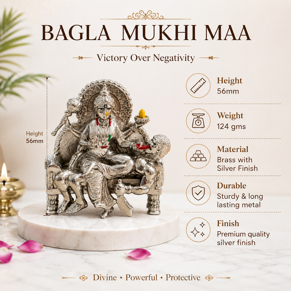 Baglamukhi Mata Brass Murti with Silver Finish placed in golden mandir backdrop with diya and flowers