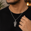 Lord Vishnu Ji pendant in brass silver finish worn by man in black t-shirt showing pendant styled for daily devotional wear