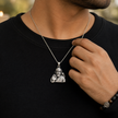 Sai Baba pendant in brass silver finish worn by man in black t-shirt with Om bead bracelet showing pendant styled for daily devotional wear