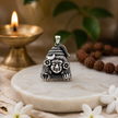 Mahadev Ji pendant in brass antique silver finish on white marble disc with rudraksha mala, lit brass diya and white jasmine flowers in soft devotional setting