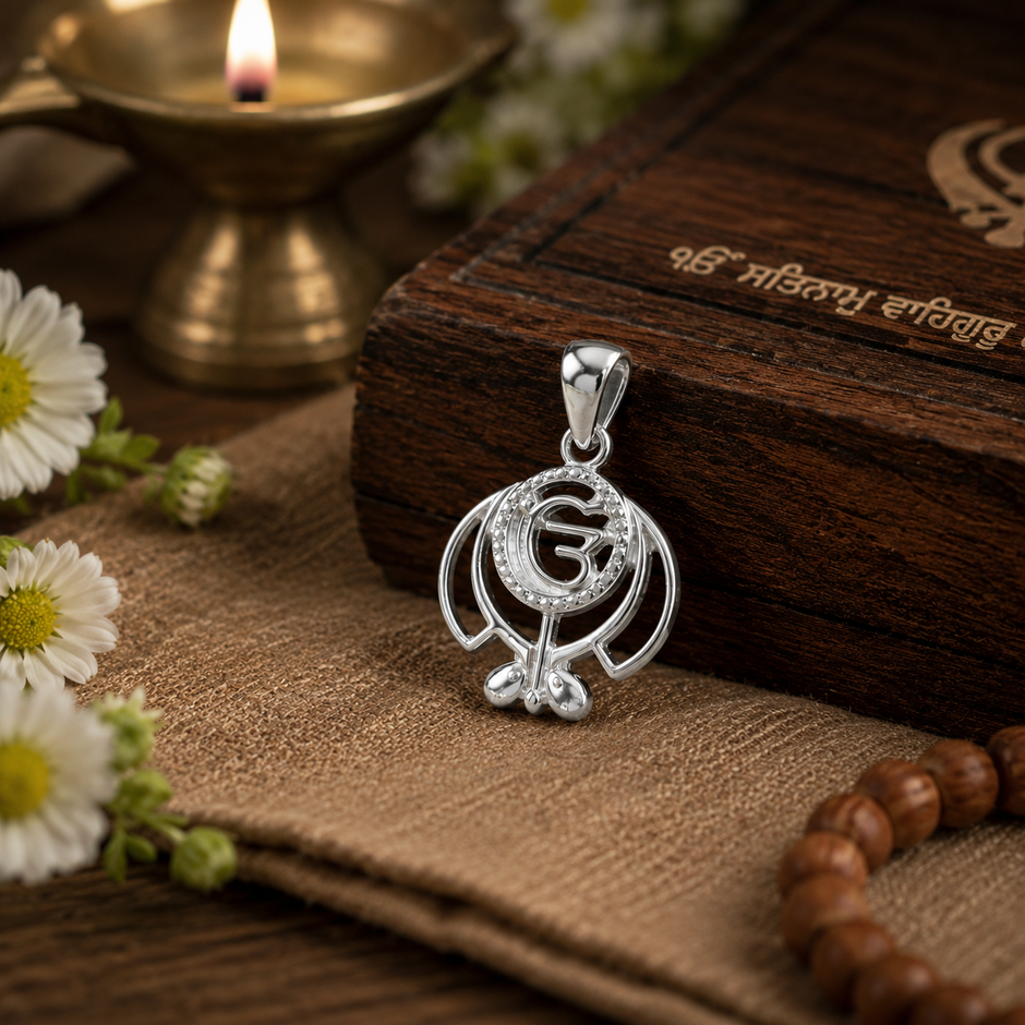 Khanda Silver Finish Pendant placed on wooden Gurbani box with daisies, mala beads and diya — devotional styling