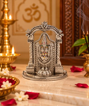 Silver finish Tirupati Balaji Venkateswara idol with ornate temple arch displayed in a traditional home mandir with diya, incense and flowers – My Guru Ji.