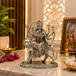 My Guru Ji brass Maa Durga idol with silver finish, intricately detailed, seated on a lion for home temple decor.