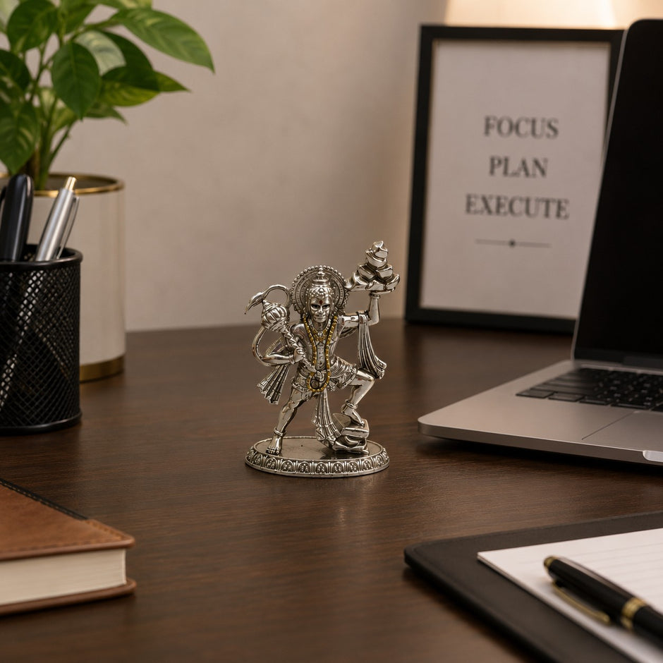 My Guru Ji silver finish brass Veer Hanuman Ji idol carrying Sanjeevani mountain on an office desk