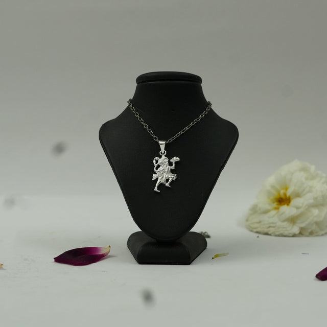 My Guru Ji silver finish brass pendant featuring Lord Hanuman carrying the Sanjeevani mountain on a display stand.