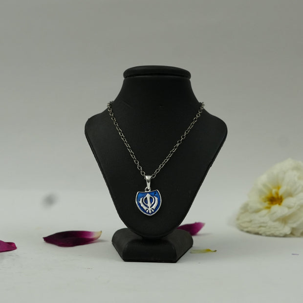 My Guru Ji silver finish brass Khanda shield pendant with blue enamel on a black display bust