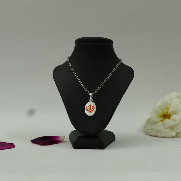 My Guru Ji silver finish brass pendant featuring a red Khanda symbol on an oval base displayed on a black bust