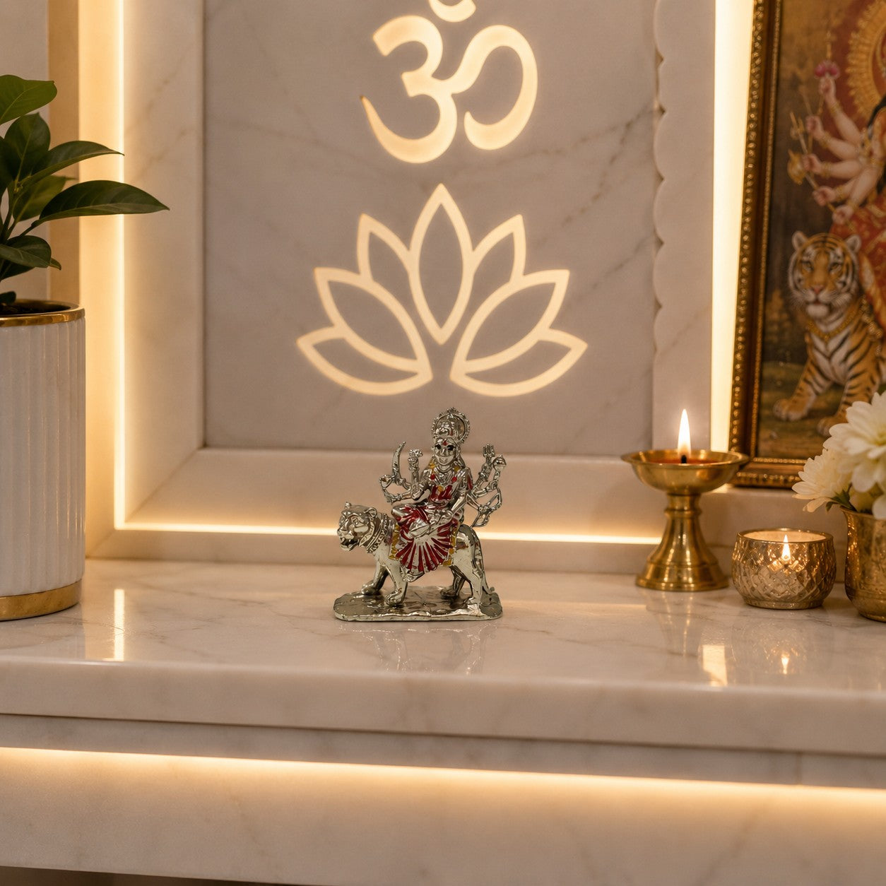 My Guru Ji Maa Durga idol in silver finish brass, seated on a lion, displayed on a marble home temple shelf.