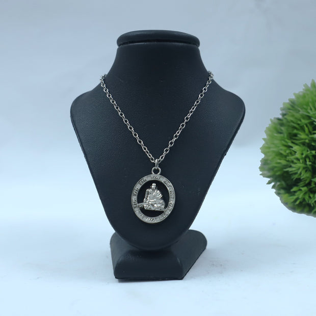 My Guru Ji silver-plated Neem Karoli Baba pendant featuring a seated figure in a circular Ram Ram engraved frame