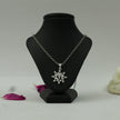 My Guru Ji silver-finish Om Vector Chakra pendant featuring a sacred symbol on a black display stand.