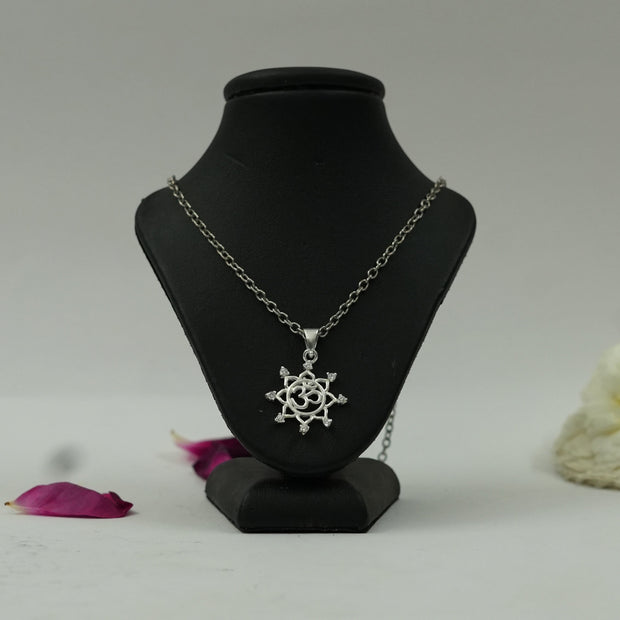 My Guru Ji silver-finish Om Vector Chakra pendant featuring a sacred symbol on a black display stand.