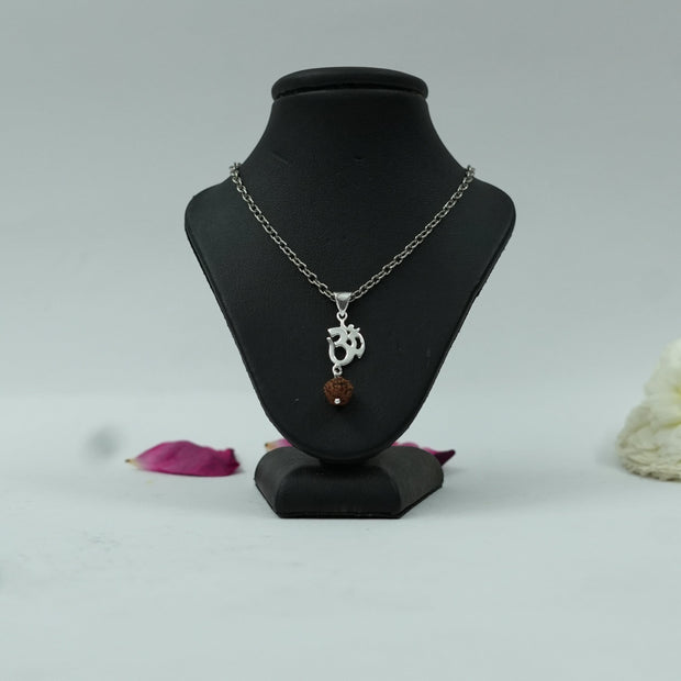 My Guru Ji silver-finish Om symbol pendant with a natural Rudraksh bead on a black display stand