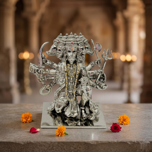 My Guru Ji silver-finished brass Panchmukhi Hanuman idol with intricate detailing, displayed on a stone surface.