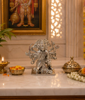 My Guru Ji Panchmukhi Hanuman idol in silver-finished brass, displayed on a marble altar with traditional decor.