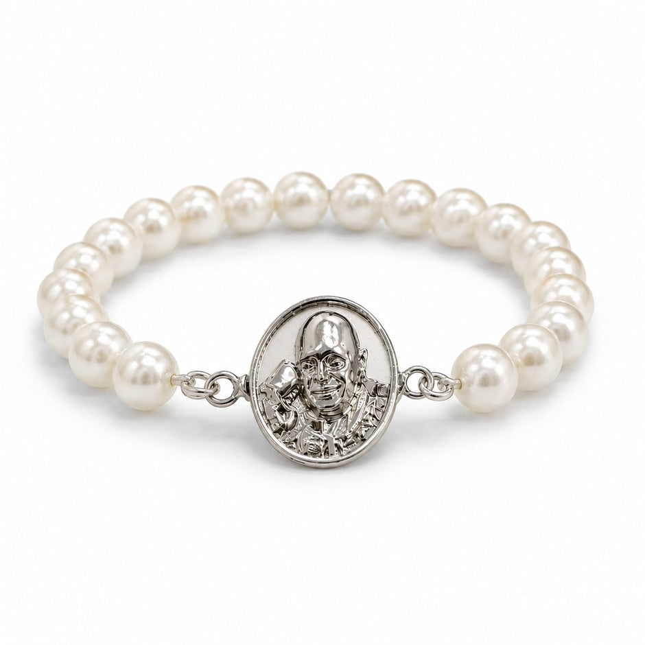 My Guru Ji pearl bracelet featuring a silver-finish brass Guru Ji charm on a stretchable white bead band.