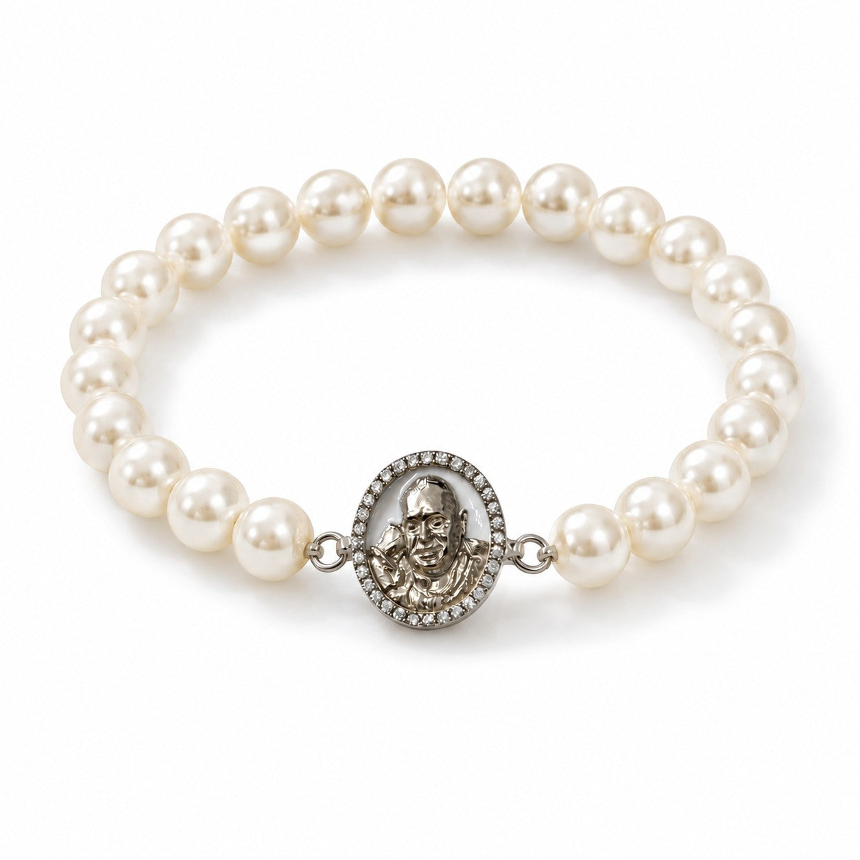 My Guru Ji pearl bracelet featuring a silver-finish brass charm with a detailed portrait, set on white pearl beads.