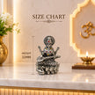 My Guru Ji silver finish brass Maa Saraswati idol seated on a lotus with a veena, featuring decorative stone accents.