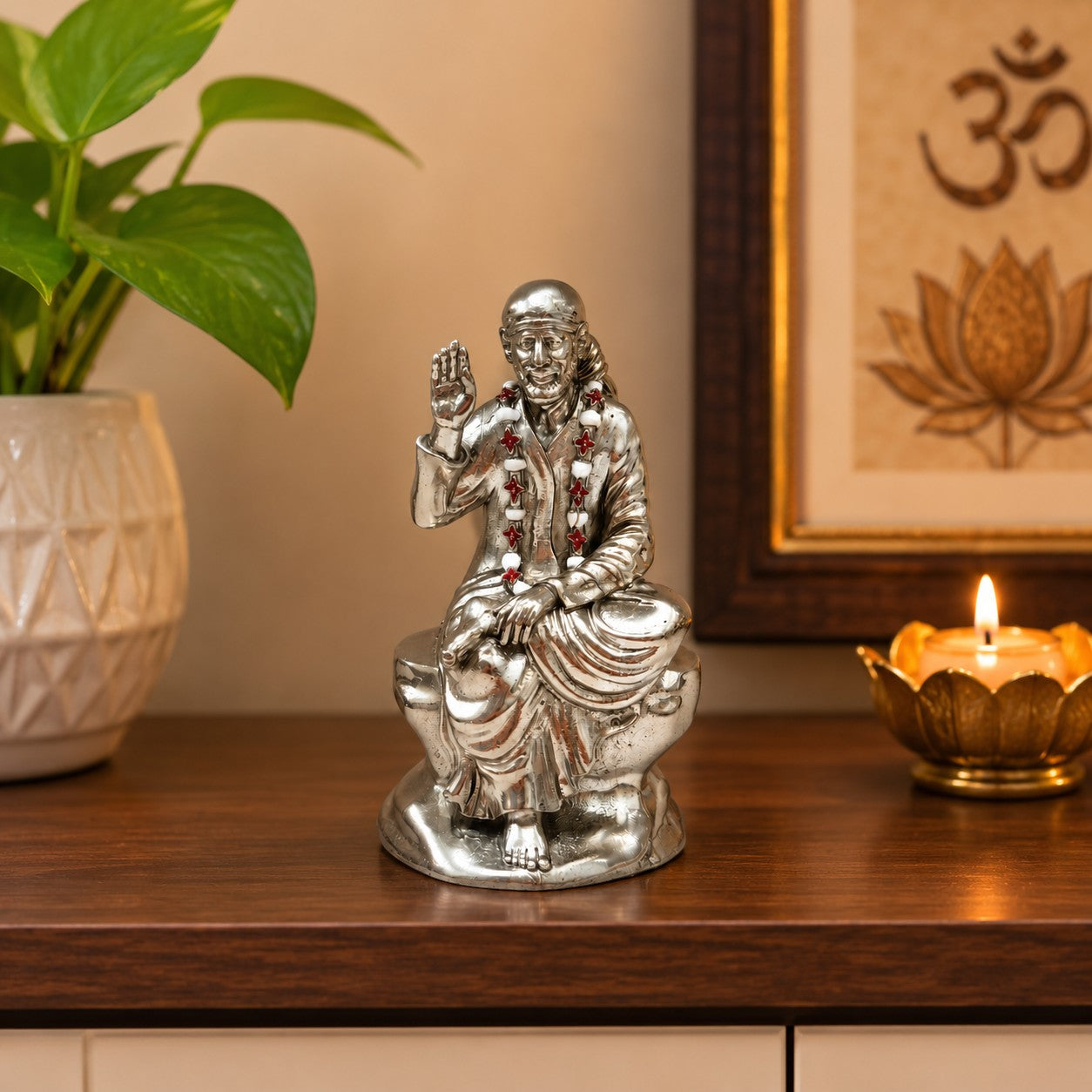 My Guru Ji Shirdi Sai Baba idol in premium brass with a silver finish, seated on a stone base for home temple decor.