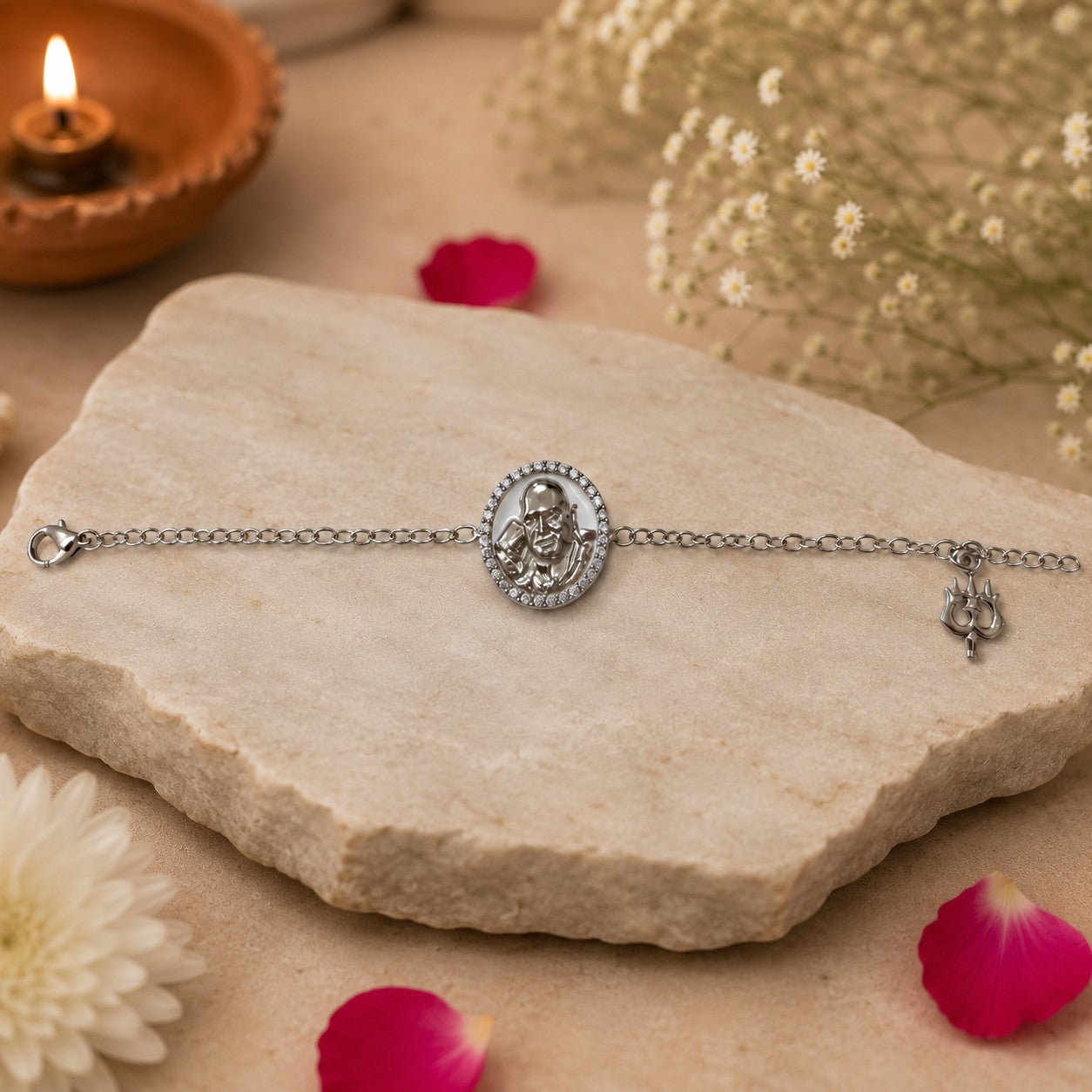My Guru Ji Shukrana bracelet in silver-plated brass with a central Guru Ji charm and trishul detail on a stone base.