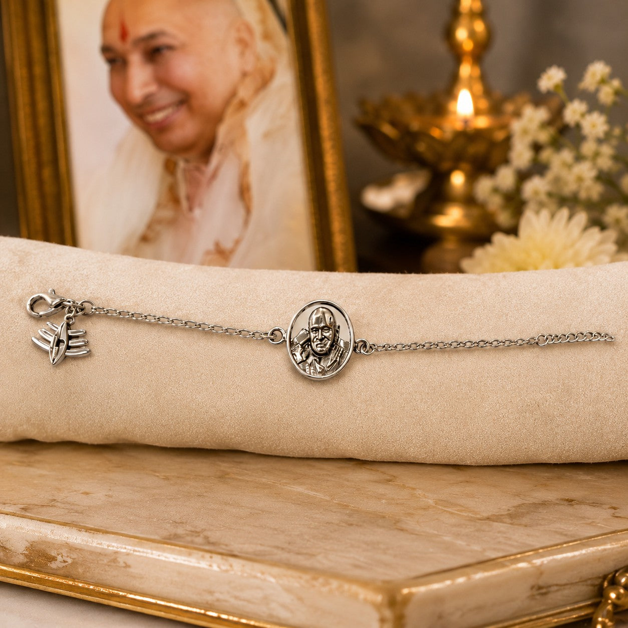 My Guru Ji silver-plated brass bracelet featuring a sacred Guru Ji portrait charm and a symbolic pendant.