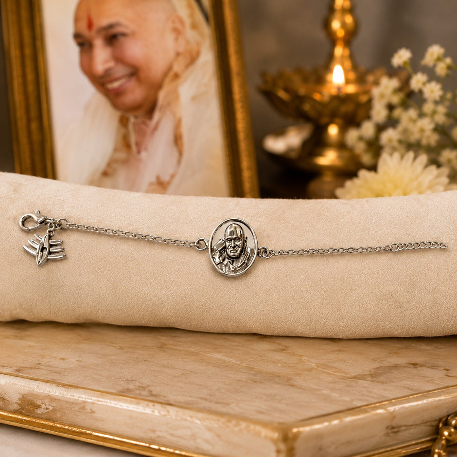 My Guru Ji silver-plated brass bracelet featuring a sacred Guru Ji portrait charm and a symbolic pendant.