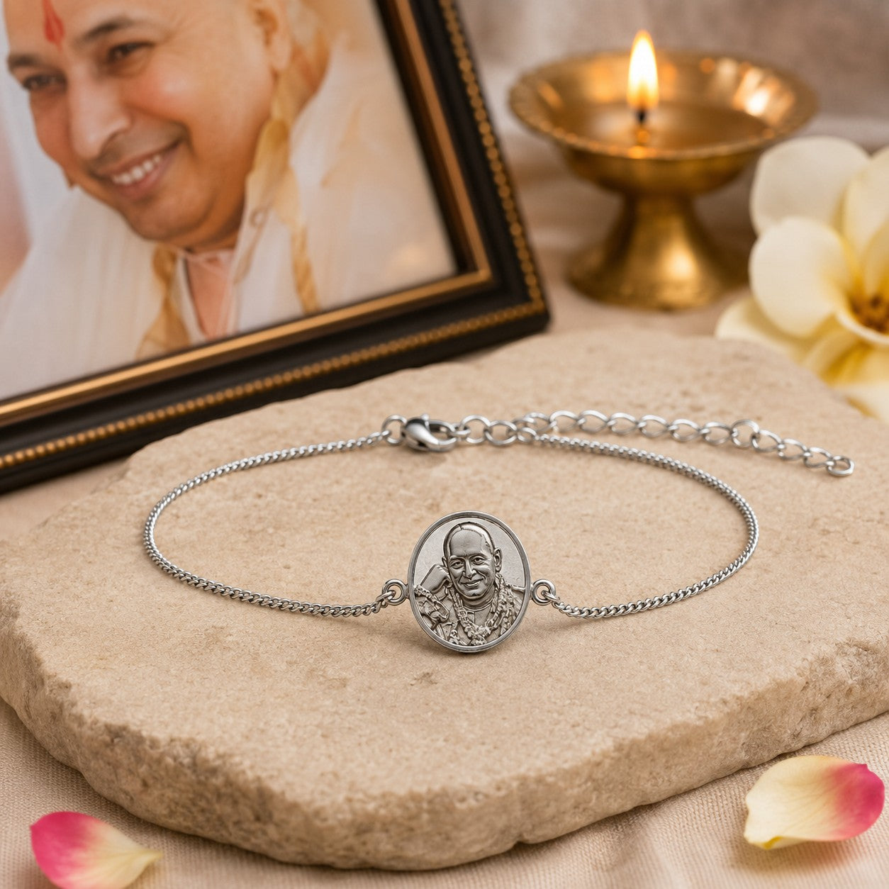 My Guru Ji silver finish brass bracelet featuring a sacred Guru Ji portrait charm and adjustable chain on stone