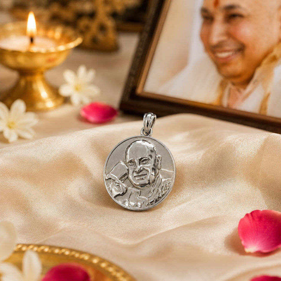 My Guru Ji round brass pendant with silver finish featuring an embossed portrait of Guru Ji on a satin cloth.