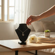 My Guru Ji silver plated brass Lord Ganesha pendant displayed on a black mannequin bust in a bright, serene room.