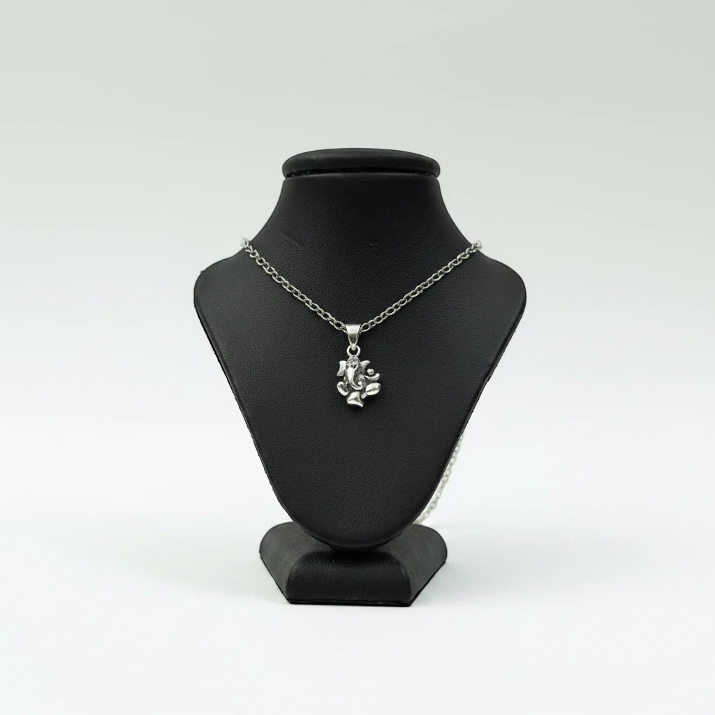 My Guru Ji silver plated brass Lord Ganesha pendant featuring fine detailing on a black display bust