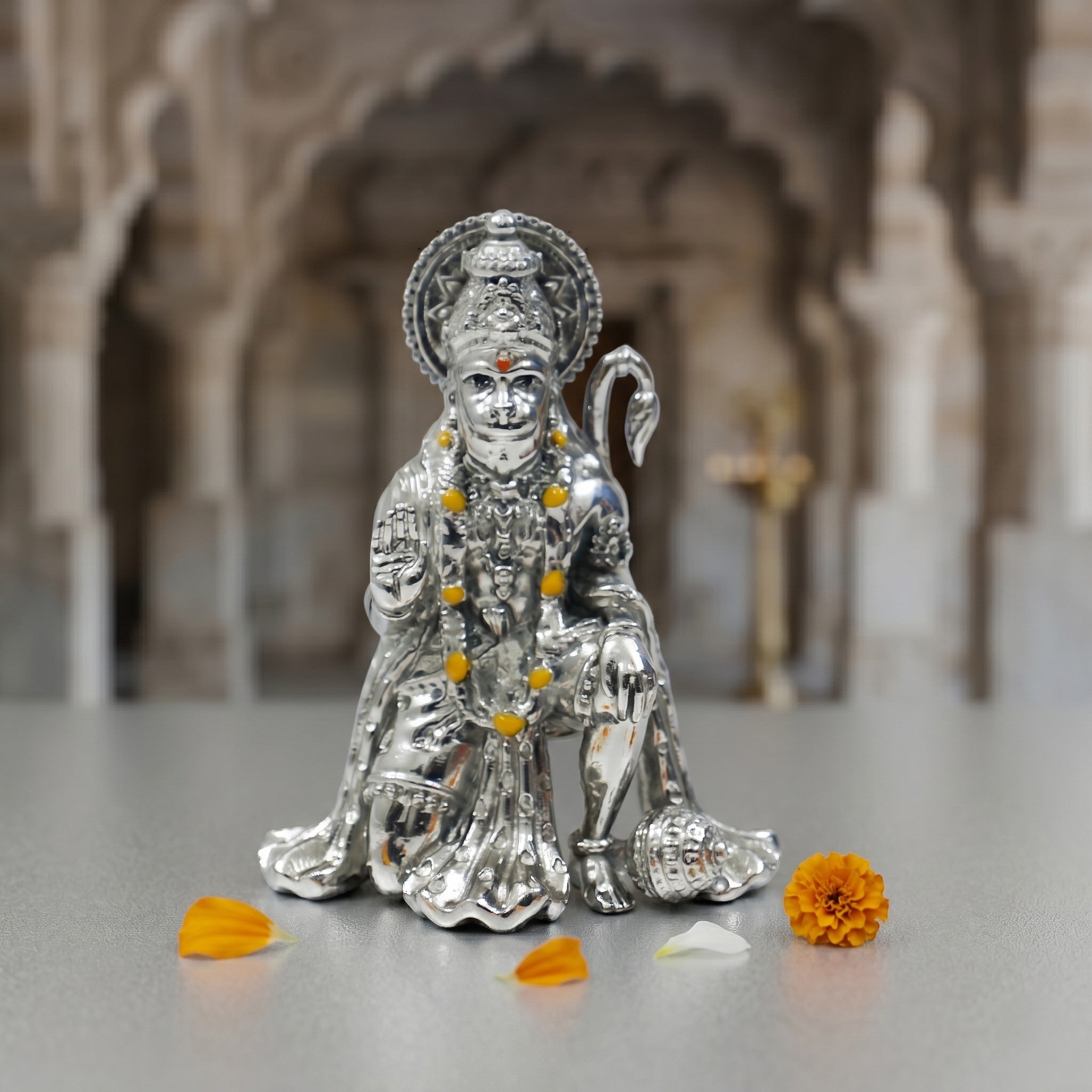 My Guru Ji silver finish brass Hanuman Ji idol in a sitting blessing posture for home temple and office decor.