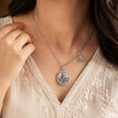 My Guru Ji silver-finish brass pendant with OM charm worn on an 18-inch chain, featuring a detailed Guru Ji portrait.