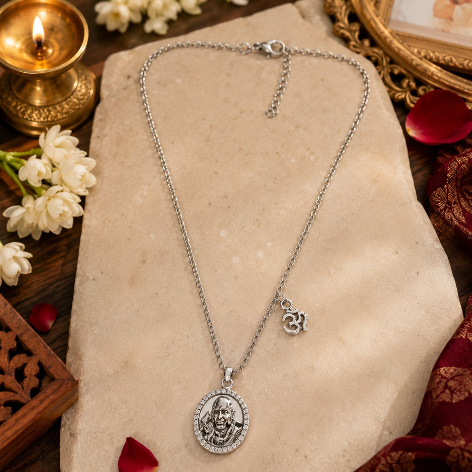 My Guru Ji silver-finish brass pendant featuring Guru Ji Bade Mandir portrait with OM charm on an 18-inch chain.