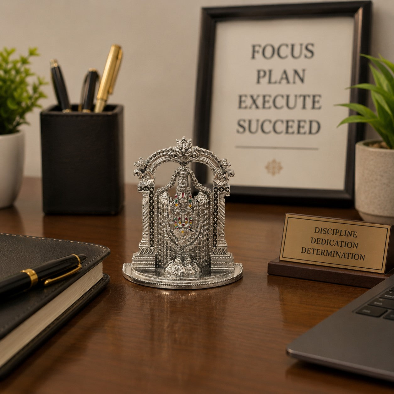 My Guru Ji silver finish brass Tirupati Balaji idol with temple arch displayed on a professional office desk.
