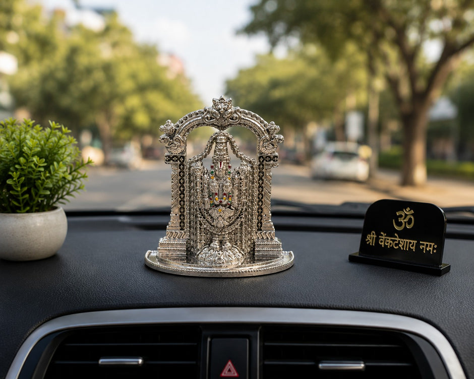 My Guru Ji silver finish brass Lord Tirupati Balaji idol with temple arch displayed on a car dashboard