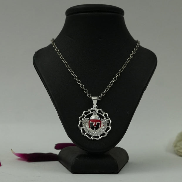 My Guru Ji Tirupati Balaji silver finish pendant with red enamel detailing on a black display stand